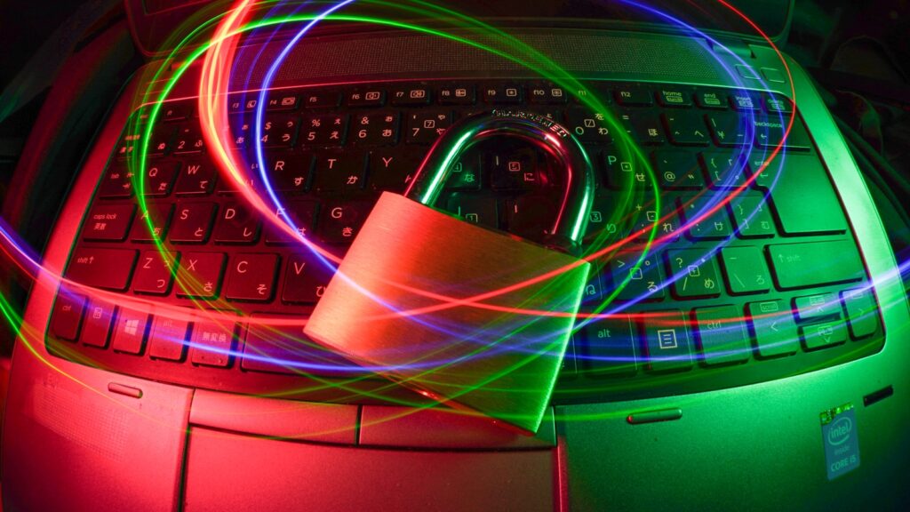 Padlock on laptop with light trails – PHP 8.4.24 Released: Critical Security Updates and Maintenance Strategy